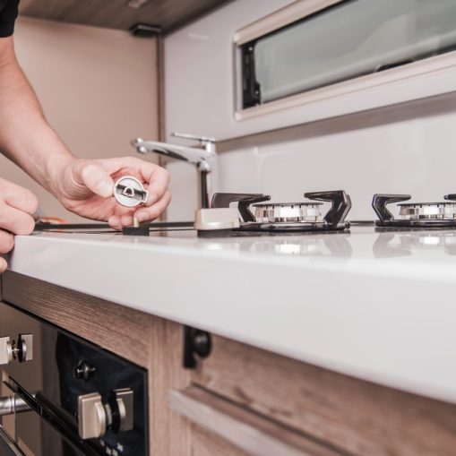 a man checking his gas stove