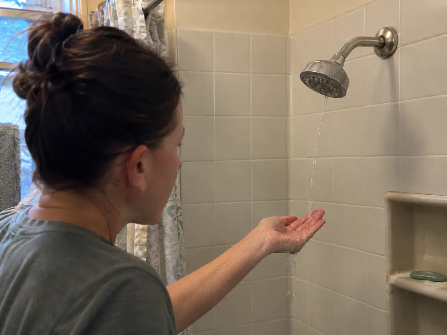 Checking the Shower Water Temperature