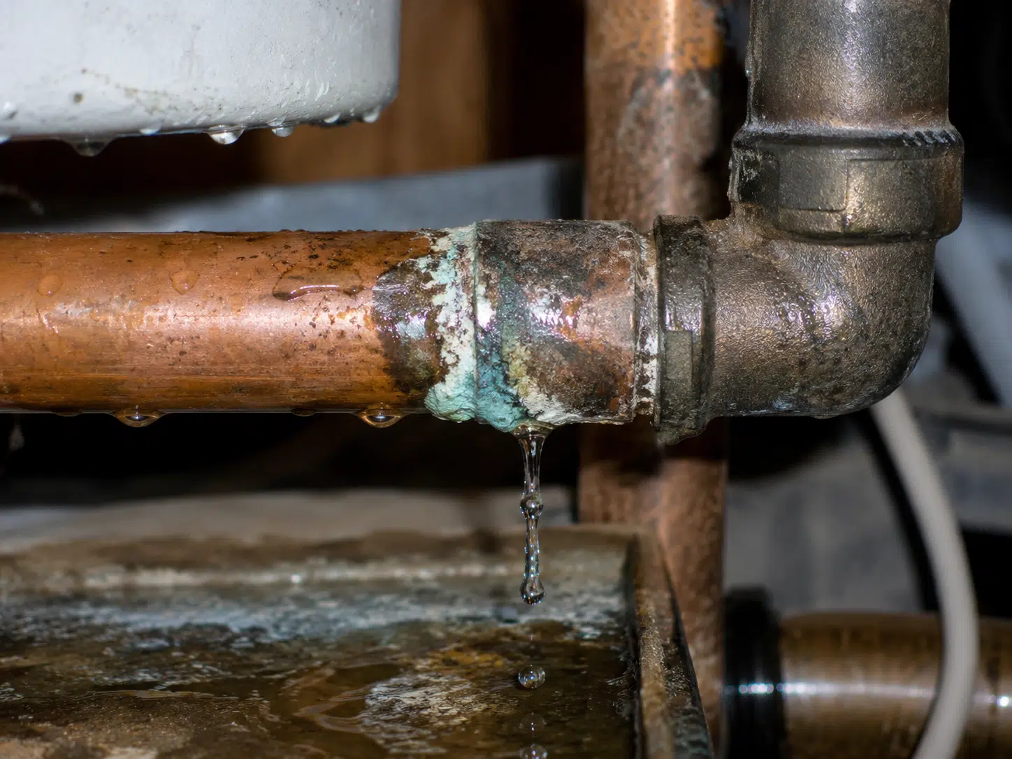 Corroded pipe with water leak