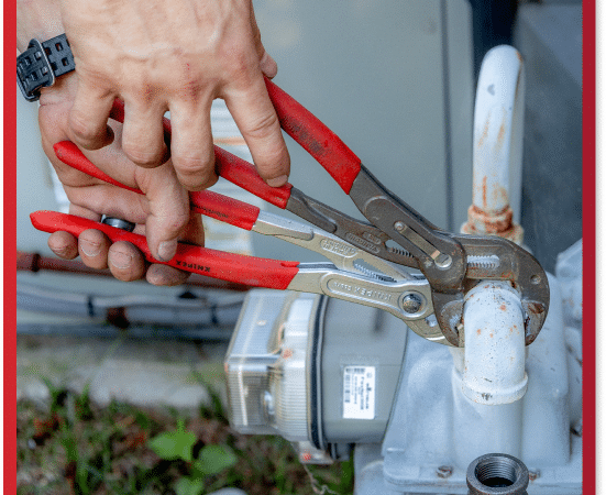 a person using a tool on a pipe