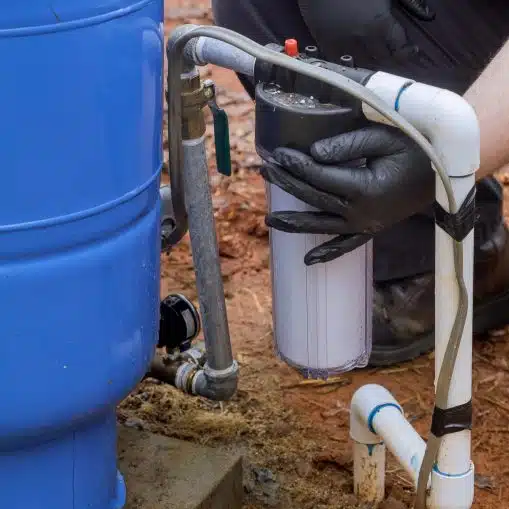 close up of installing water filter system on a private well