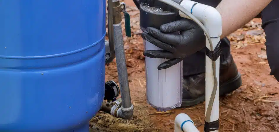 close up of installing water filter system on a private well