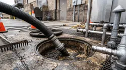 commercial grease interceptor being professionally pumped and serviced