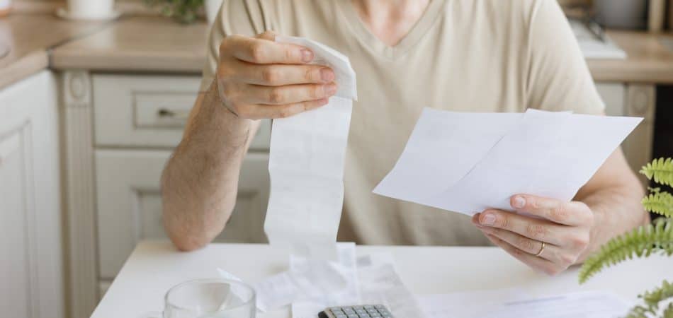 man wondering his spike in water bill