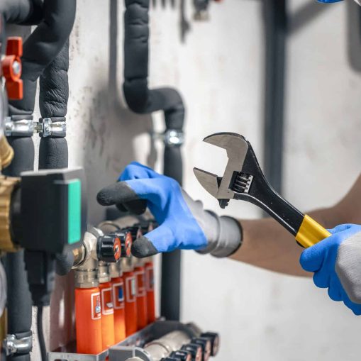 plumber fixing heater system