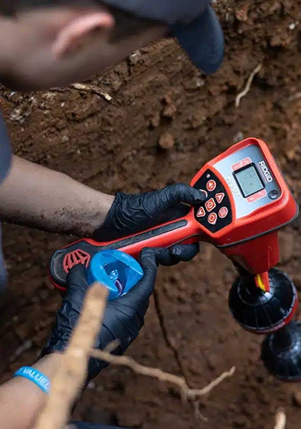 a RIDGID NaviTrack Scout Locator, specifically used for finding underground pipes, cables, and transmitters.